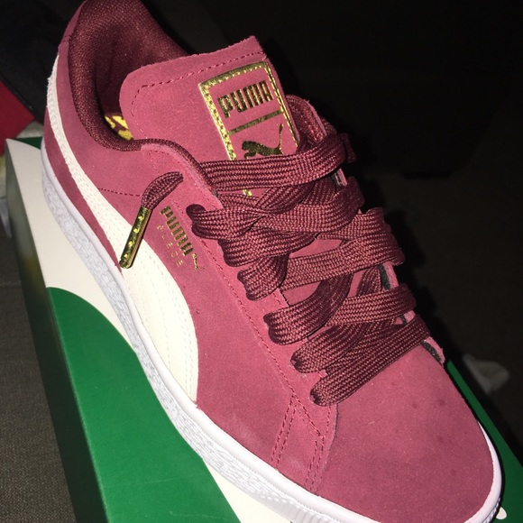 burgundy pumas with gold